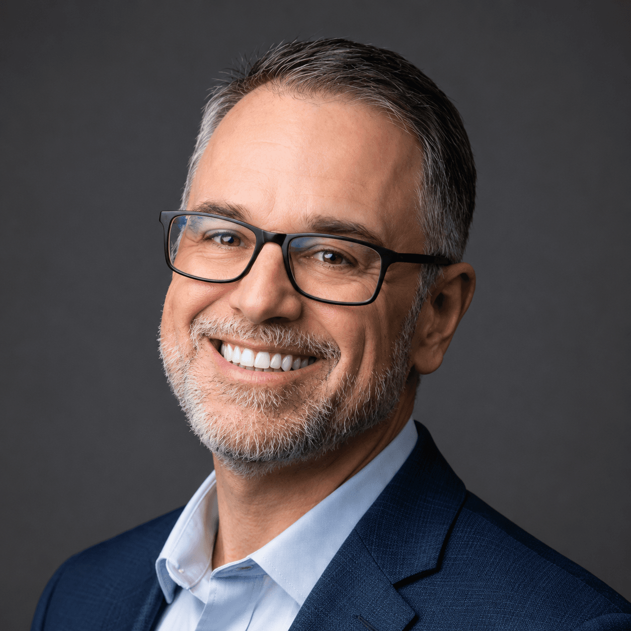David Solis, B2B webinar strategist, smiling in a navy blazer